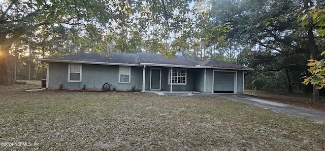 rear view of house with a garage