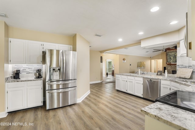 kitchen featuring tasteful backsplash, ceiling fan, appliances with stainless steel finishes, and white cabinetry