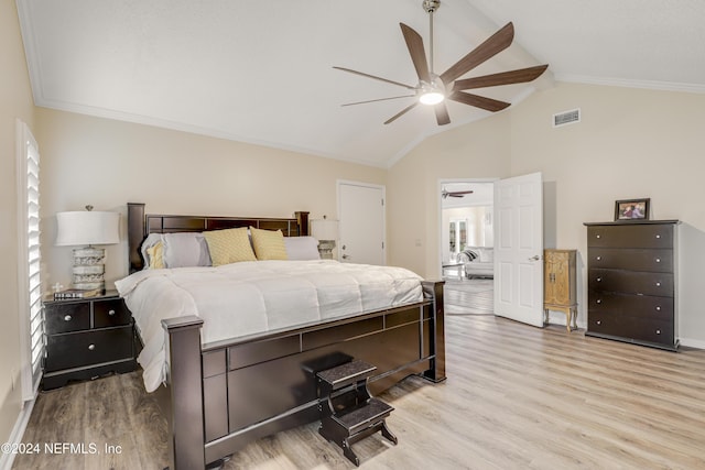 bedroom with ceiling fan, light hardwood / wood-style flooring, lofted ceiling, and ornamental molding