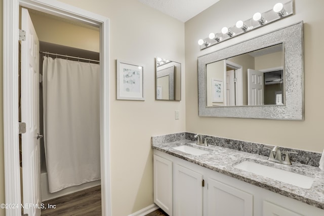 bathroom with vanity and hardwood / wood-style floors