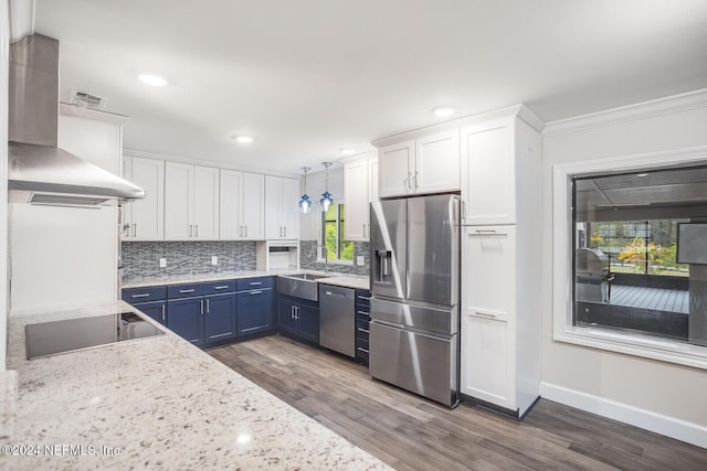 kitchen featuring white cabinets, plenty of natural light, blue cabinetry, and appliances with stainless steel finishes