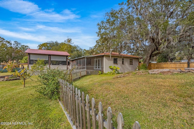 view of yard with a sunroom