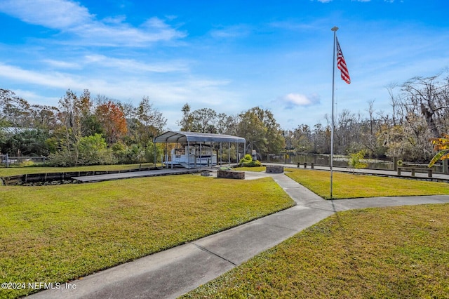 view of home's community featuring a lawn