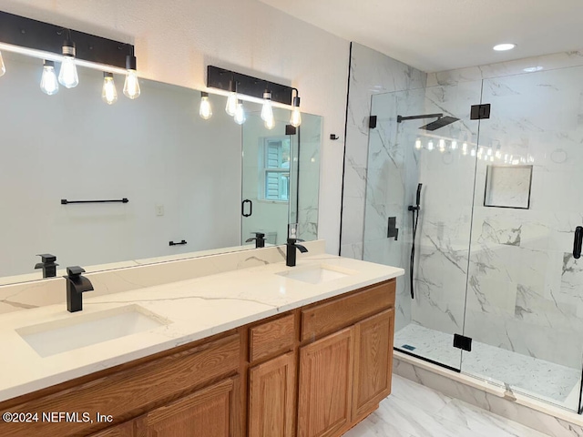 bathroom featuring vanity and a shower with shower door