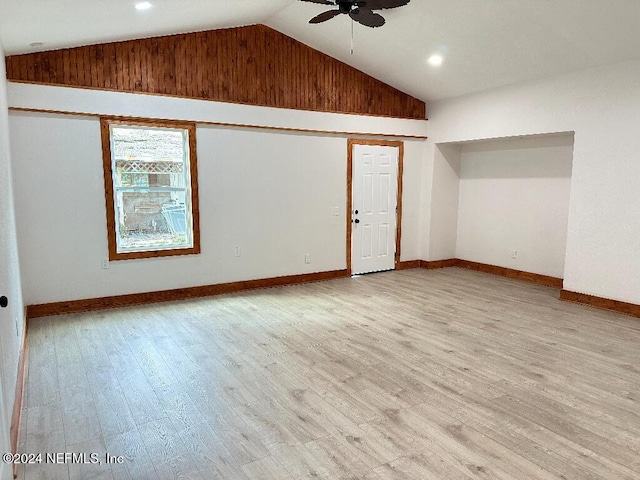 unfurnished room with ceiling fan, high vaulted ceiling, and light hardwood / wood-style floors