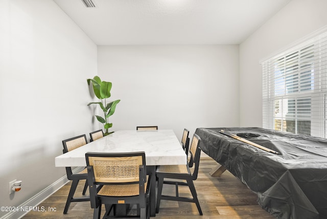 dining area with dark hardwood / wood-style flooring and billiards