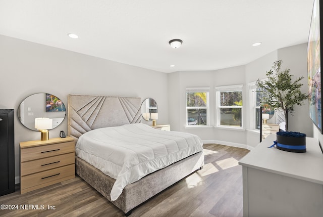 bedroom with dark wood-type flooring