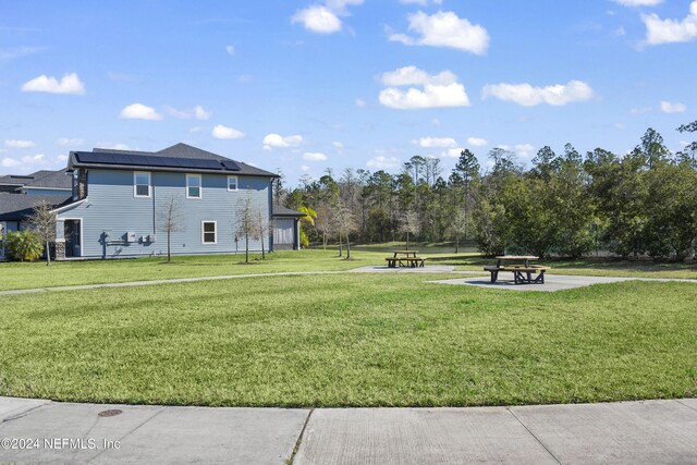 view of community featuring a yard