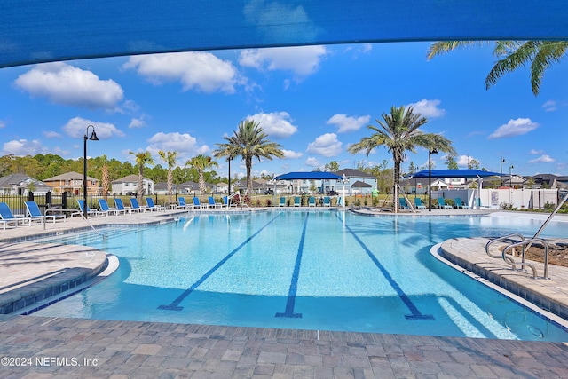 view of swimming pool featuring a patio area