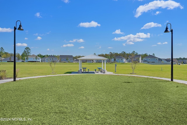 view of home's community featuring a gazebo and a yard