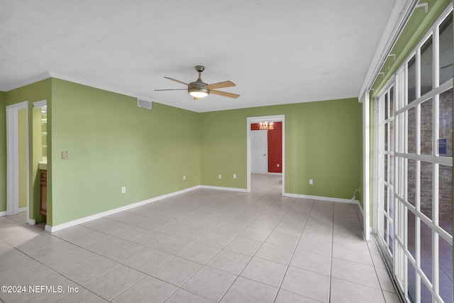 unfurnished room with ceiling fan and light tile patterned floors