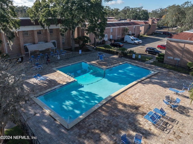 view of swimming pool featuring a patio