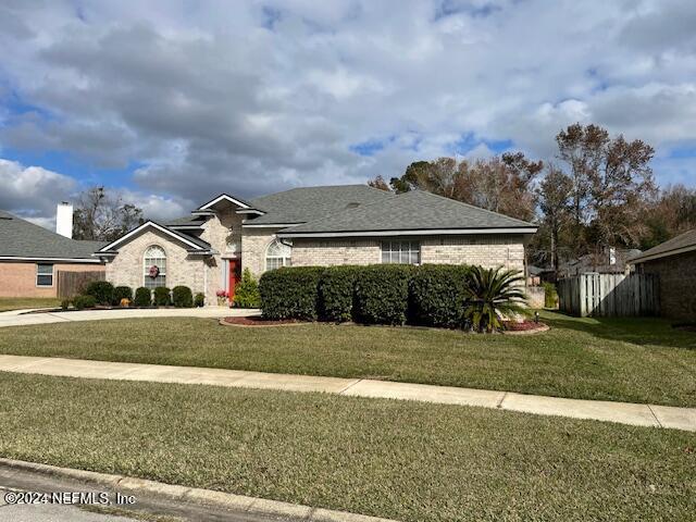 1837 The Glades Rd, Middleburg, FL 32068 - view of front of house featuring a front lawn and brick siding