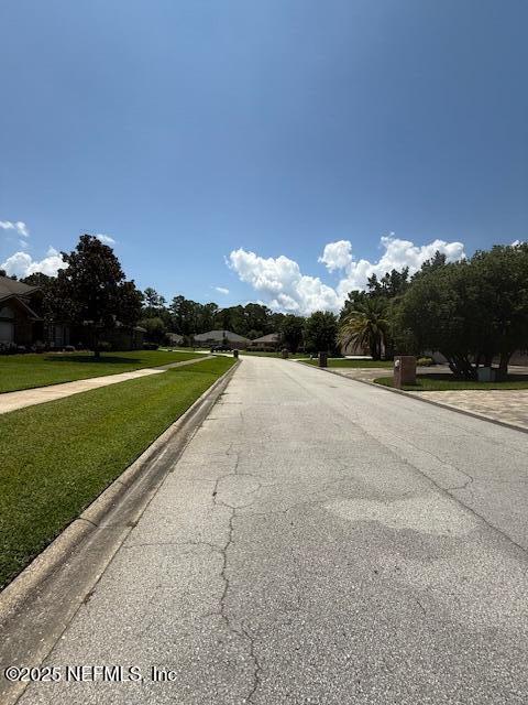 1837 The Glades Rd, Middleburg, FL 32068 - view of asphalt road featuring sidewalks and curbs