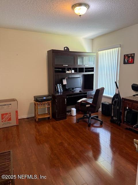 1837 The Glades Rd, Middleburg, FL 32068 - home office featuring wood finished floors and a textured ceiling
