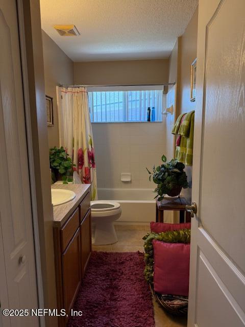 1837 The Glades Rd, Middleburg, FL 32068 - full bathroom featuring vanity, shower / tub combo, and a textured ceiling