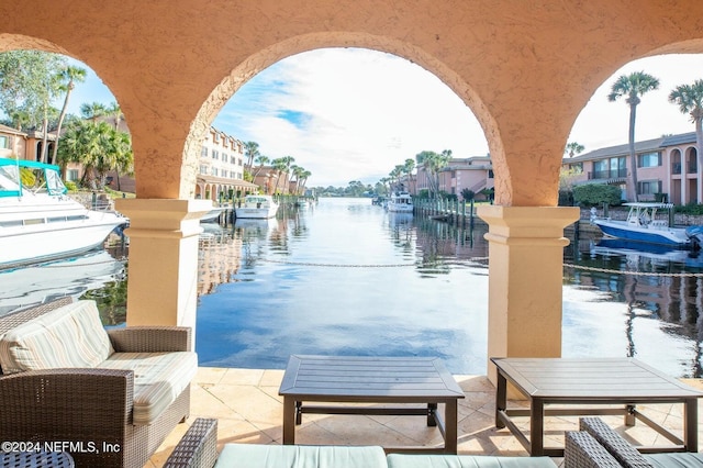 view of patio with a water view