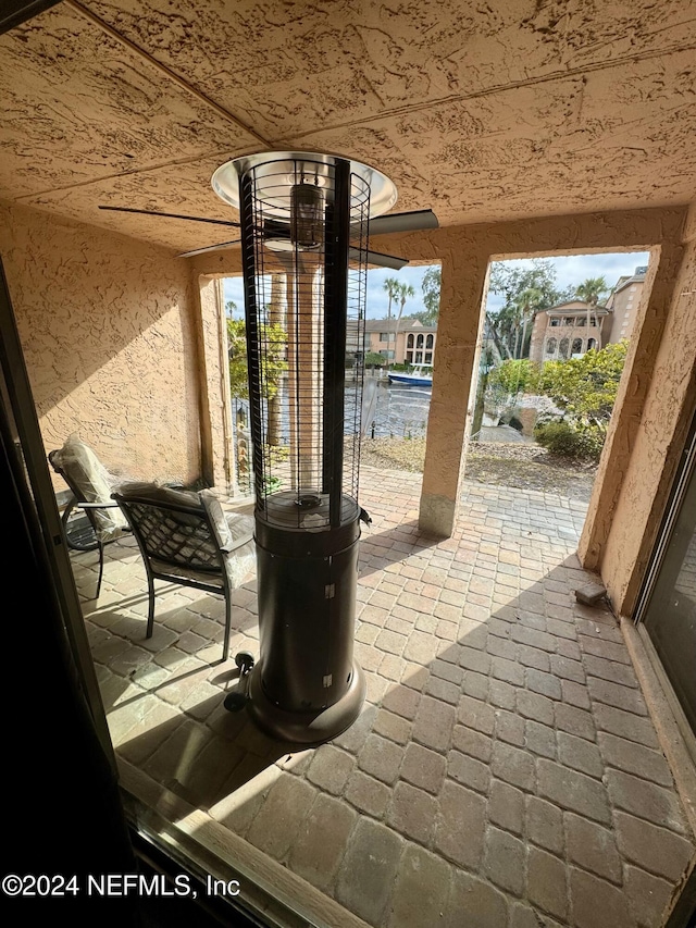 view of patio with a water view