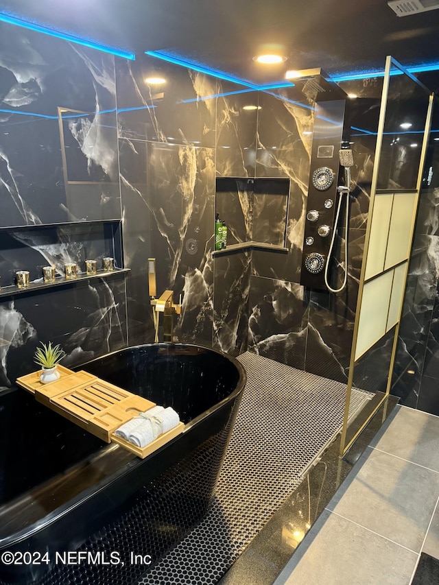 bathroom with tasteful backsplash, a soaking tub, visible vents, walk in shower, and tile patterned floors