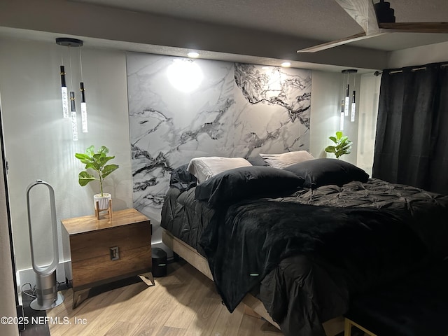 bedroom with light wood-style flooring