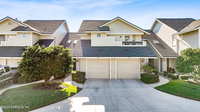 view of front of house with a balcony and a garage