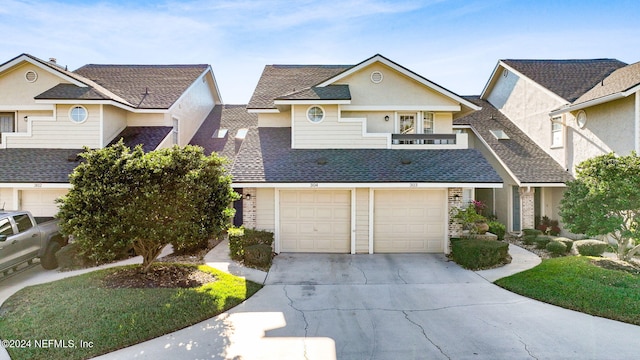 304 Tournament Rd, Ponte Vedra Beach, FL 32082 - view of front of house with driveway, a shingled roof, and an attached garage