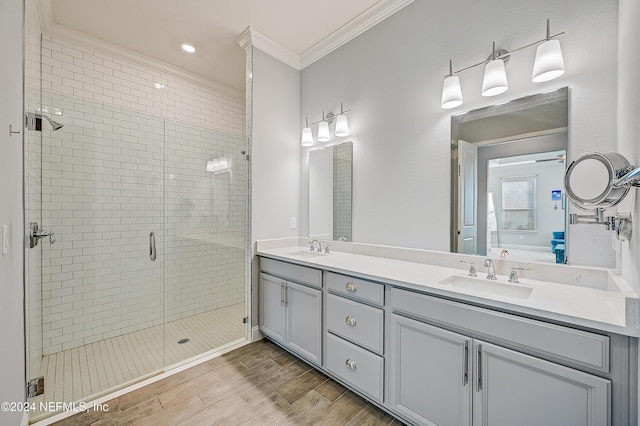 bathroom featuring crown molding, vanity, and an enclosed shower