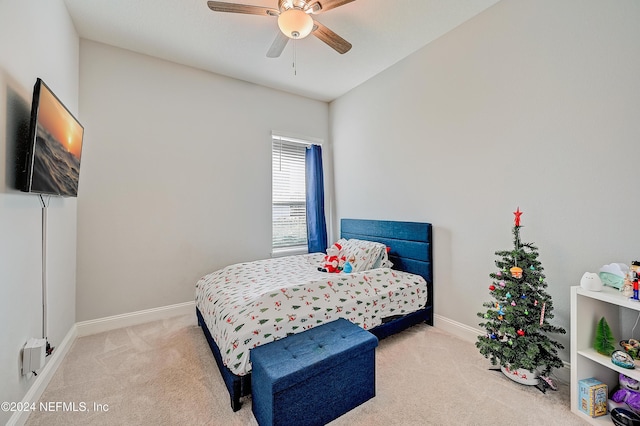 bedroom featuring ceiling fan and light colored carpet