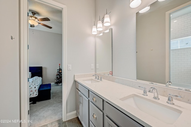 bathroom featuring wood-type flooring, vanity, and ceiling fan