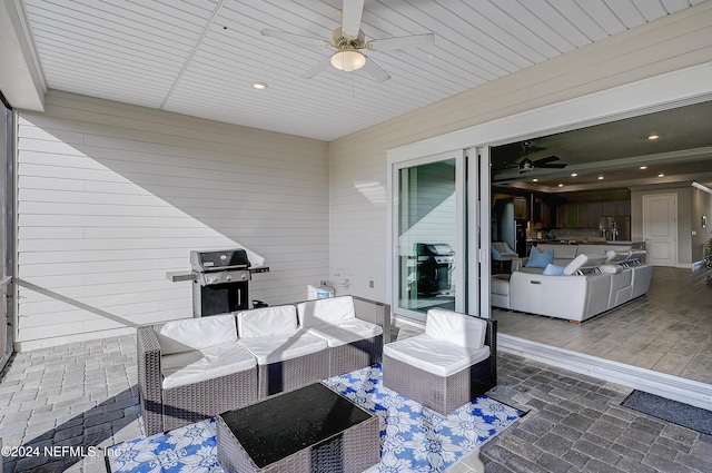 view of patio with an outdoor hangout area, grilling area, and ceiling fan