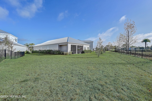 view of yard with a sunroom