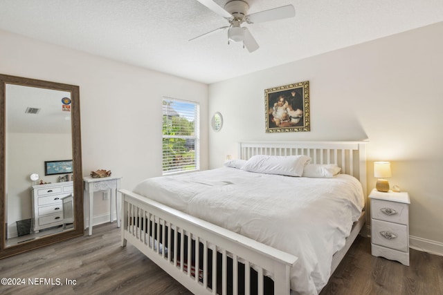 bedroom featuring ceiling fan and dark wood-type flooring