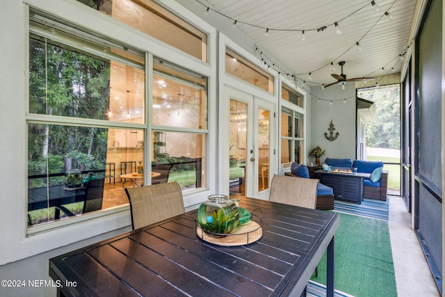 sunroom with ceiling fan and french doors