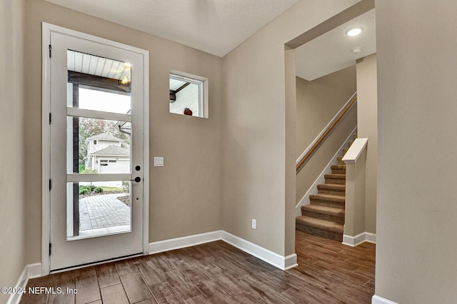 foyer with a textured ceiling