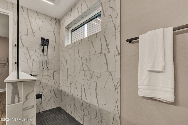 bathroom featuring tiled shower