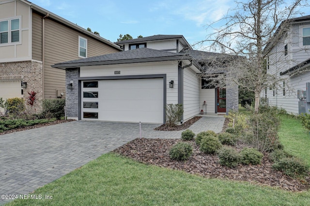 view of front of property with a garage