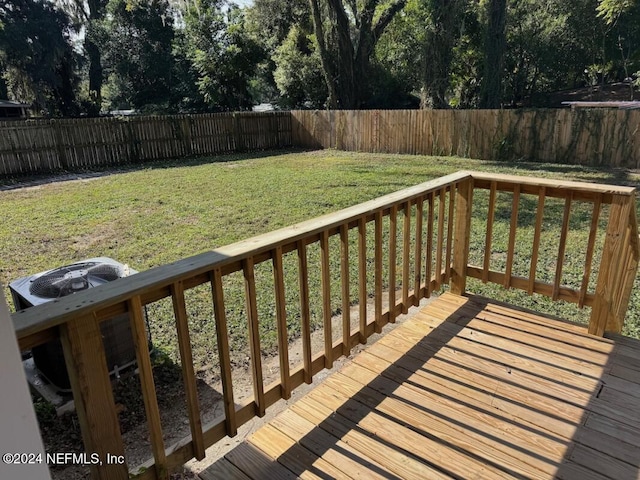 wooden terrace with a yard and central AC