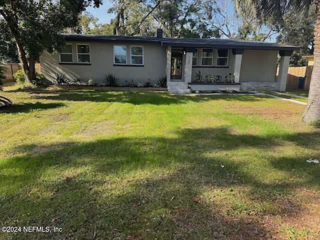 ranch-style home with a front yard