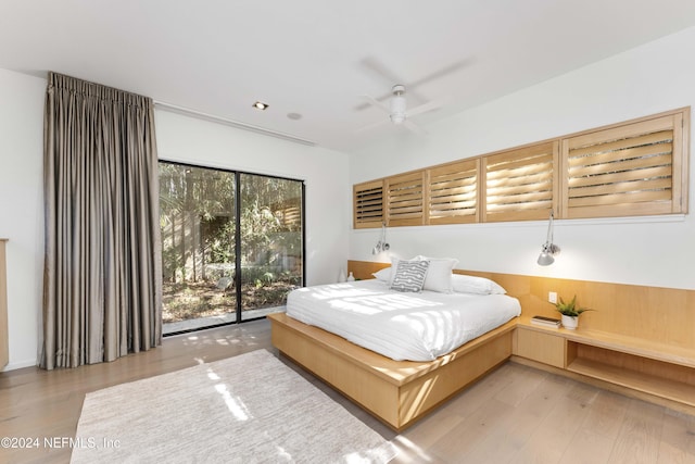 bedroom with ceiling fan, light wood-type flooring, and access to outside