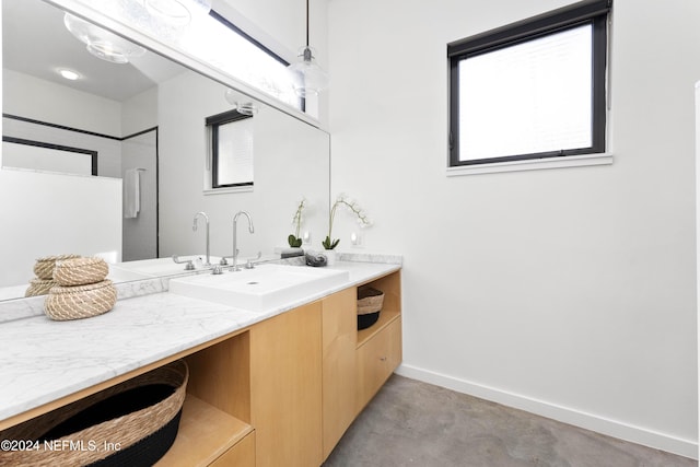 bathroom featuring vanity and concrete floors