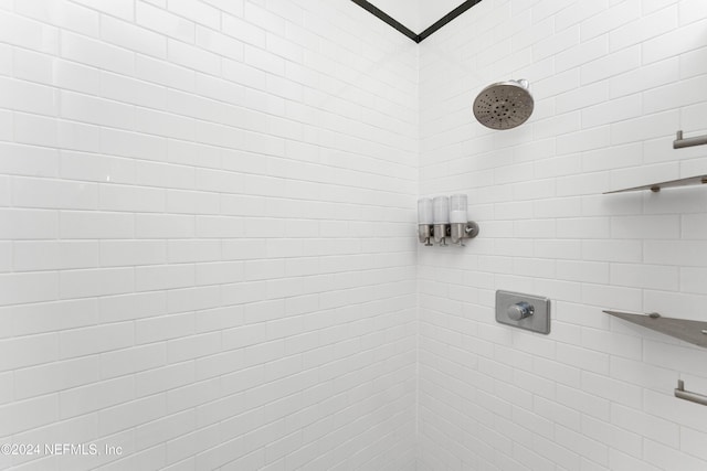 bathroom with a tile shower