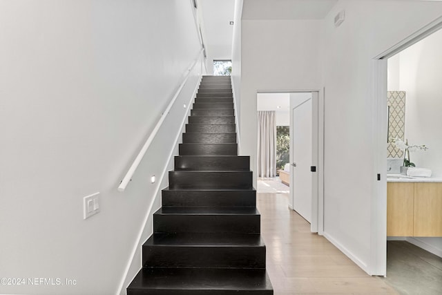 stairway featuring hardwood / wood-style flooring