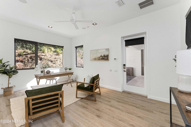 office space featuring light hardwood / wood-style floors and ceiling fan