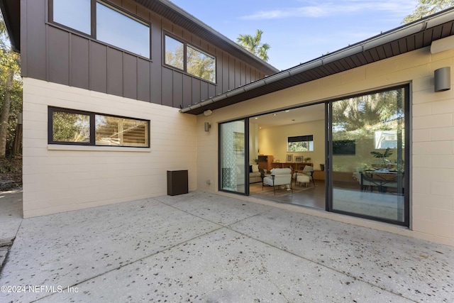 rear view of property featuring a patio area