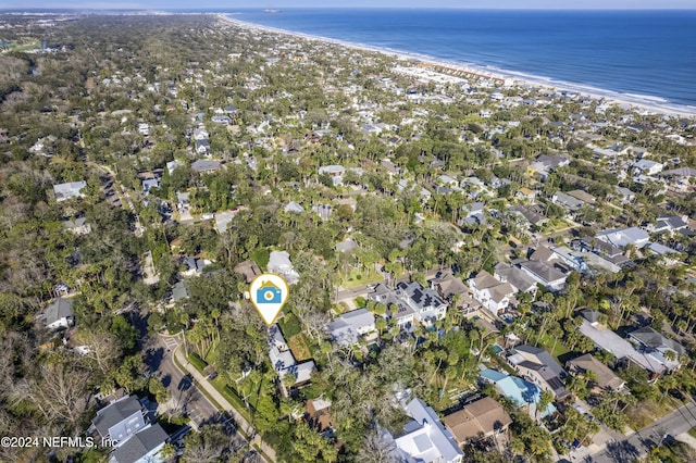 bird's eye view featuring a water view and a beach view