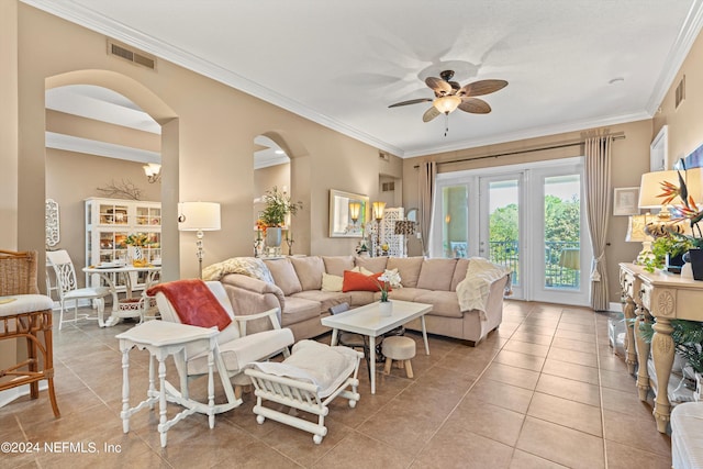 tiled living room featuring ceiling fan and ornamental molding