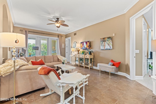 living room featuring ceiling fan, light tile patterned floors, and ornamental molding