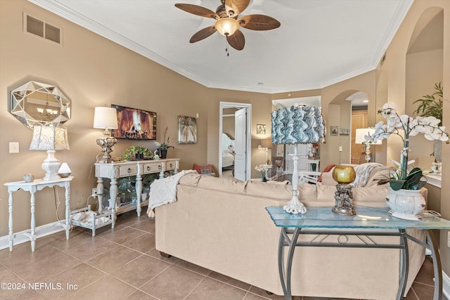 living room with tile patterned floors, ceiling fan, and ornamental molding