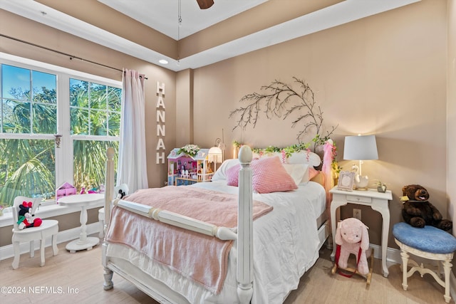 bedroom with hardwood / wood-style flooring and ceiling fan