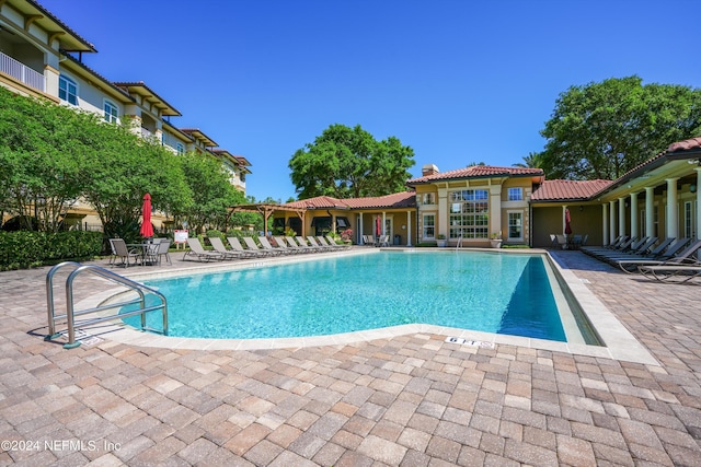 view of swimming pool with a patio